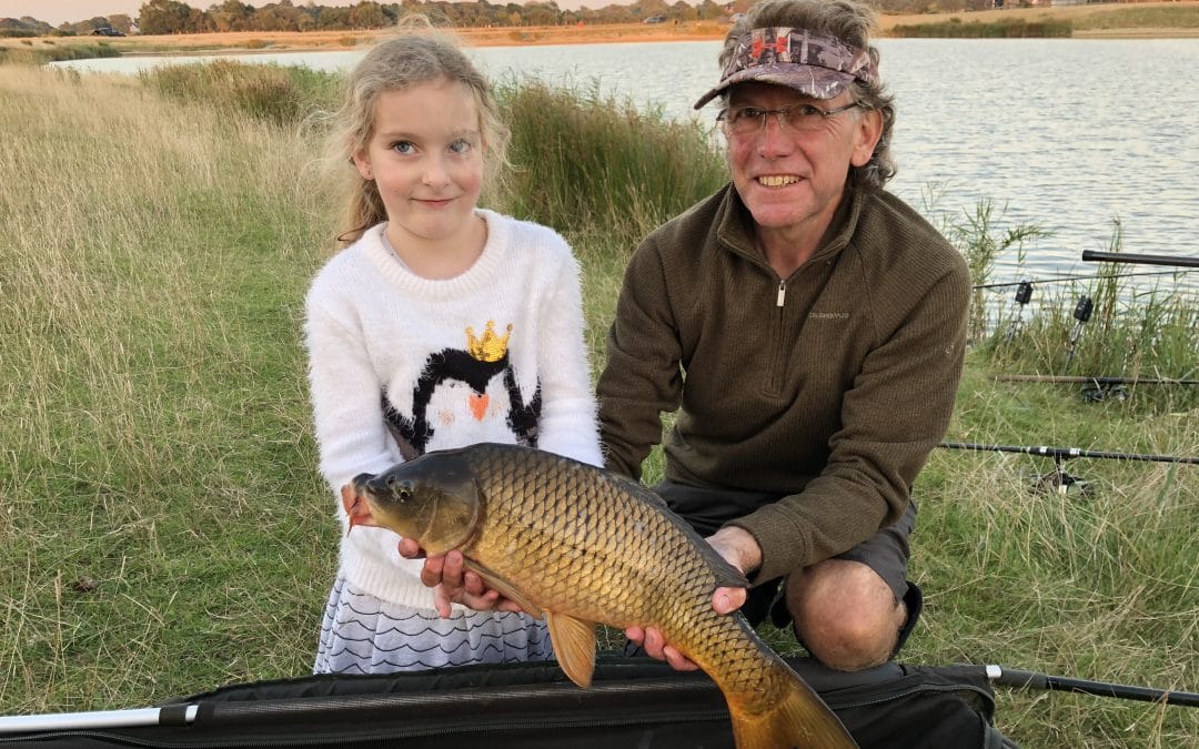 Isla Catches her first carp while carp fishing and camping in Kent